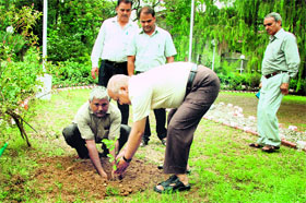 Arun Dhaundiyal, Secretary to Uttarakhand Governor, plants a sapling at Raj Bhawan in Dehradun on Wednesday.