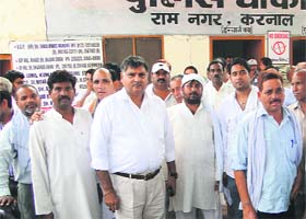 BJP activists assemble at the Ram Nagar police post in Karnal on Wednesday