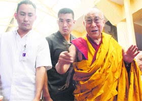 The Dalai Lama returns from the main temple after delivering a discourse in Dharamsala on Tuesday