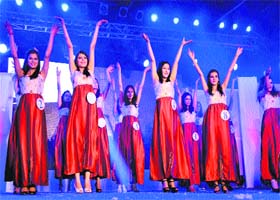 Participants perform in a talent round during the Miss Shimla contest at the Summer Festival-2013 on the Ridge in Shimla on Tuesday night