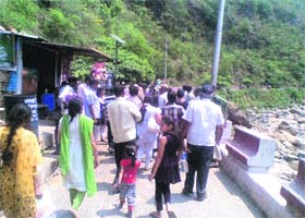 Pilgrims embark on the 4-km trek to the Shiv Khori cave shrine without being frisked in Ransoo in Reasi district