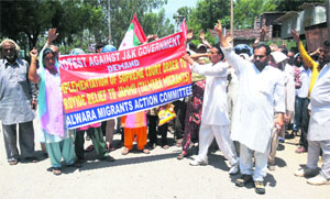Talwara migrants stage a protest against the state government at the DC office in Reasi on Wednesday. 