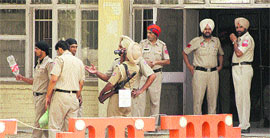 Cops in a relaxed mood after having managed to arrest the accused who had fled from the court complex in Jalandhar on Wednesday.