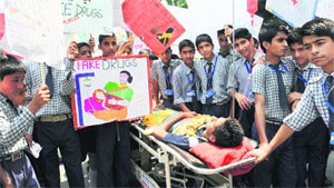 Schoolchildren protest against fake drugs scam that rocked the state recently, in Srinagar on Wednesday. 
