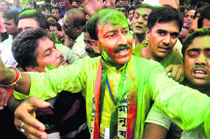 TMC candidate Prasun Banerjee with his supporters after his victory in Lok Sabha bypoll in Howrah on Wednesday.