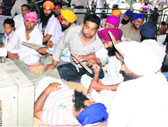 Jobless linemen on fast outside the PSPCL headquarters in Patiala on Wednesday.