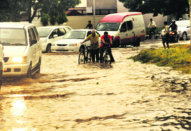 A waterlogged road in Sector 34 after rain on Thursday.