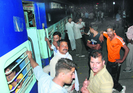 Himalayan Queen passengers wait for the train to leave from the Chandigarh railway station after it got delayed on Thursday.
