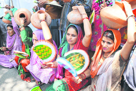 Activists of the Dogra Front and Shiv Sena protest in Jammu on Thursday.