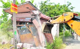 A shop built on MC land being razed during a demolition drive in Bank Colony in Ludhiana on Thursday