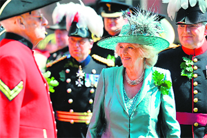 Camilla, Duchess of Cornwall, inspects Chelsea Pensioners, all British veteran soldiers, during the annual Founder's Day Parade at the Royal Chelsea Hospital in London on Thursday.