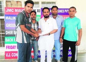 A member of the winning Bhandari Engineering team receives a prize during the presentation ceremony at the Police Public School grounds in Bathinda on Friday