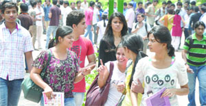 Students throng Faculty of Arts, North Campus, to submit their forms on the third day of the admission process at Delhi University on Friday. 