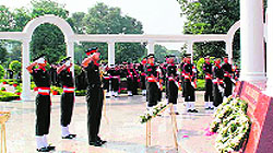 Lt-Gen Manvender Singh (top), Commandant, IMA, salute the martyrs after laying a wreath at the War Memorial at the academy in Dehradun on Friday
