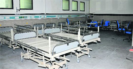 Beds lie unused in one of the wards at  Specialty Hospital in Jammu.