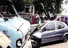 Residents look at the vehicles that collided on the Chandigarh road in Ludhiana on Friday