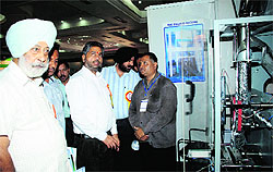 Tarsem Saini, president of the Federation of All-Indian Rice Millers Association, interacts with rice machinery manufacturers at Sahnewal on Friday