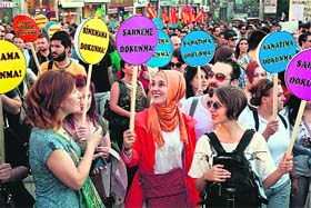 Demonstrators hold placards reading "Don't touch my cinema, don't touch my stage, don't touch my art, don't touch my lifestyle" during a protest at the Taksim square in Istanbul on Friday