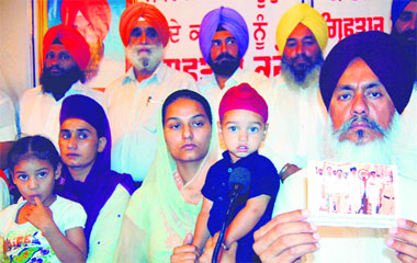 Family members of Youth Congress leader Sukhraj Singh Bhagupur, who was allegedly killed by SAD supporters in the run-up to the Zila Parishad elections, and Congress leader Harminder Singh Gill (right) address mediapersons in Amritsar on Saturday. 