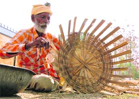 At work: A worker is busy making a basket on Saturday afternoon in Bathinda