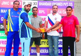 A player receives an award after the match in Bathinda on Saturday