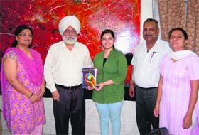 Honouring talent: DAV College organised a function to felicitate Anju Sharma who topped the list of successful candidates with 82 per cent marks in the first semester of B.Sc. (non-medical)