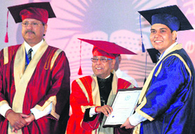 President Pranab Mukherjee presents degree to a student at the convocation ceremony of IIT Indore on Saturday.
