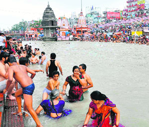 Pilgrims take a holy dip in the Ganga on Shani Jyanti at Haridwar on Saturday.