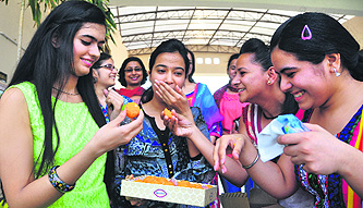 Students of Sri Aurobindo College of Commerce and Management celebrate their success in Ludhiana.