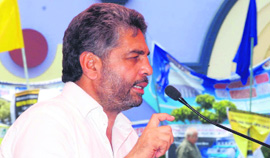 Tarsem Singh Saini speaks during the general house meeting of the Punjab Rice Millers Association.