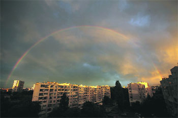 A quiver full of colours: A rainbow is seen at sunset behind apartment buildings after rainfall at a suburb of Sofia, Bulgaria
