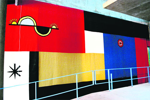 The tapestry near the entrance lounge of the Assembly depicting the theme of 24 solar hours