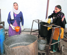 Employees of Hindustan Pharmaceuticals prepare extract of herbs at a unit in Amritsar. 