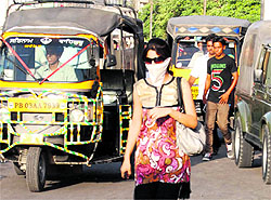 Women cover their faces while venturing out in the hot sun for work in Bathinda on Sunday. With summer showing no signs of relenting, people are resorting to various ways to protect themselves from heat