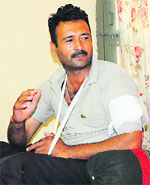 Injured Home Guards driver Jatinder Singh at his residence in Sector 20, Chandigarh, on Sunday. 