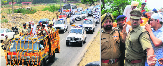 Inspector Sucha Singh's funeral convoy on its way to the cremation ground; and (right) his son, supported by Manish Chaudhary (centre), Senior Superintendent of Police (Traffic) and RS Ghuman (left), Senior Superintendent of Police (Operations), carries his body in Sector 25.