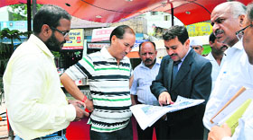 Chief Secretary Subhash Kumar inspects a roundabout in Dehradun on Saturday.
