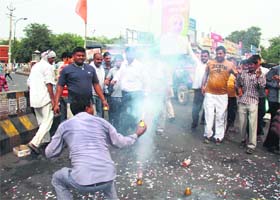 BJP workers celebrate the appointment of Gujarat Chief Minister Narender Modi as the campaign in charge in Gurgaon on Sunday