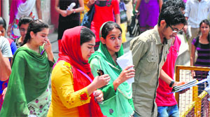 Students come out of Government College for Women, Parade, after appearing in the Polytechnic Diploma Entrance Examination, 2013, in Jammu on Sunday.