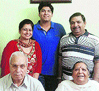 Viveksheel, who got 148th rank in India, with his parents in Jalandhar on Sunday