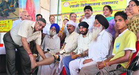Artificial limbs being distributed to the needy during a camp organised by the Bharat Vikas Parishad at Kitchlu Nagar.