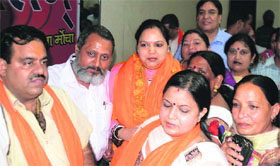 District BJP Mahila Morcha President Sakshi Julka (third from left) is felicitated by party members at the Samiti Bhawan in Ludhiana on Sunday.