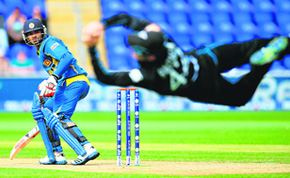 Nathan McCullum catches Kusal Perera off the first ball during the Champions Trophy match between Sri Lanka and New Zealand on Sunday.
