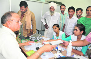 Dr Ramesh Maheshwari, president of the PCMS Specialists Association, attending to patients during the strike.