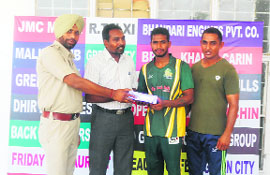A player receives his award after the match.