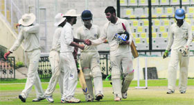 Anmol of Mohali, who hit a century against Chandigarh, shakes hand with other team members during the Dhruv Pandove Cricket Tournament at PCA Stadium in Mohali on Monday.