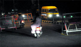 Permanent barricades set up on a road leading to Mohali from Chandigarh without police personnel.