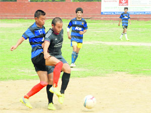 A match in the B.S. Negi Memorial Football Tournament played at Ambedkar Stadium in Dehradun on Monday.
