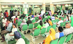 Applicants wait for their turn for getting documents at the Suwidha Centre in Jalandhar on Monday