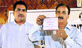 State Joint Director of Census Operations CS Saproo (right) releases census data at a press conference in Srinagar on Monday.